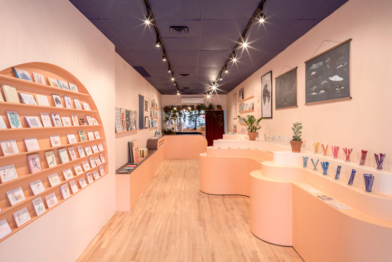 Baltic Stationary shop with peach colored walls and curved display cases