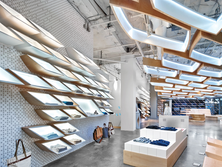 Angular shelves on a perforated metal wall in a retail store interior design