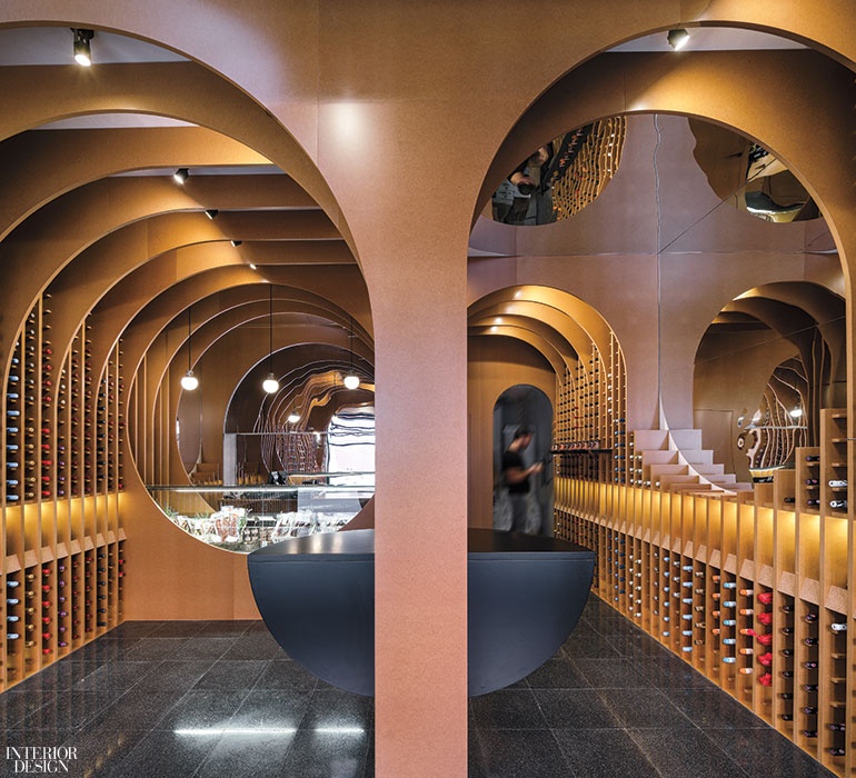 A retail store interior design with archways and gold hued walls