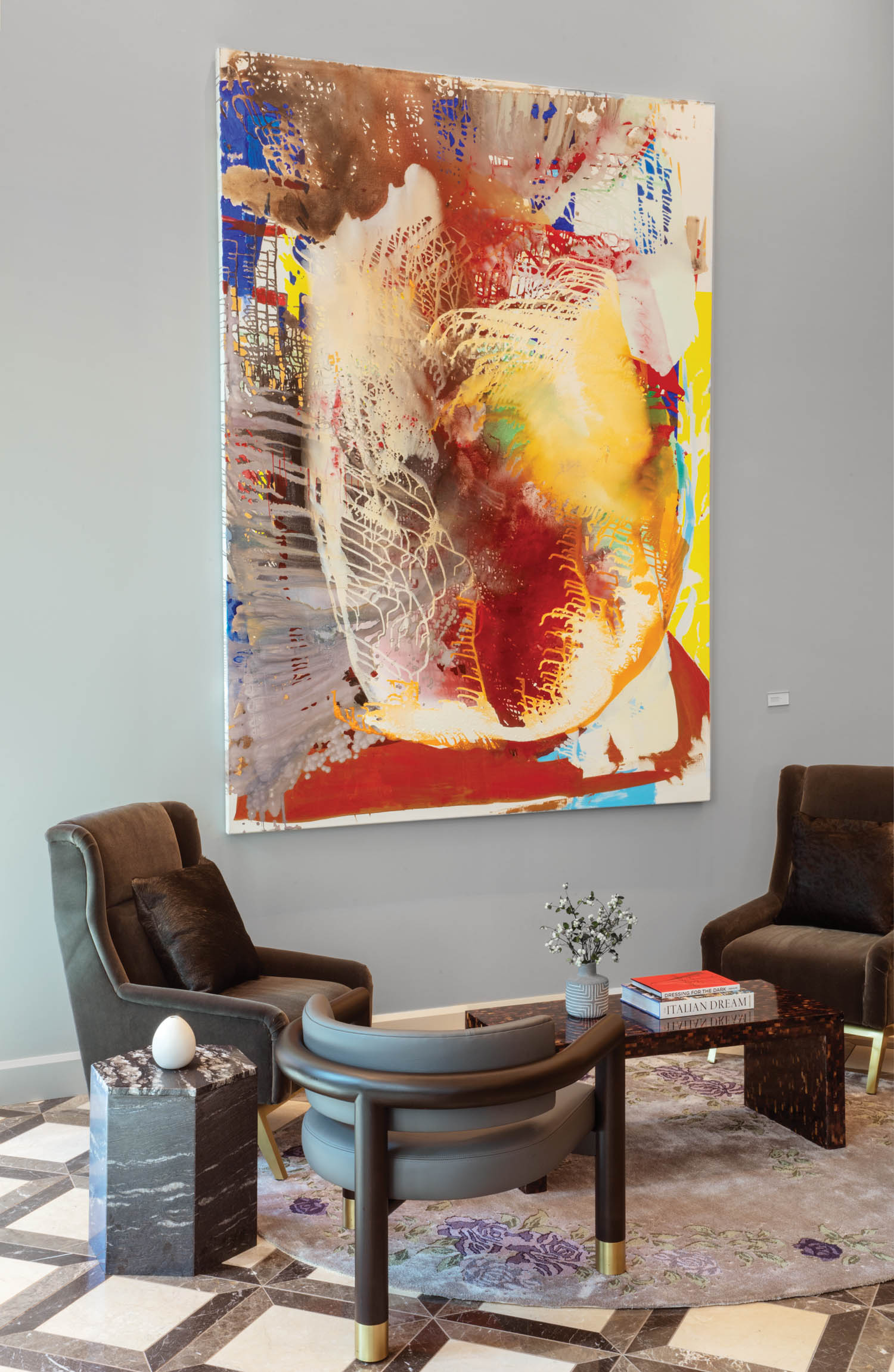 Mohair upholsters the lobby’s custom wingback chairs standing near a Jackie Saccoccio oil on linen. Photography by Eric Laignel.