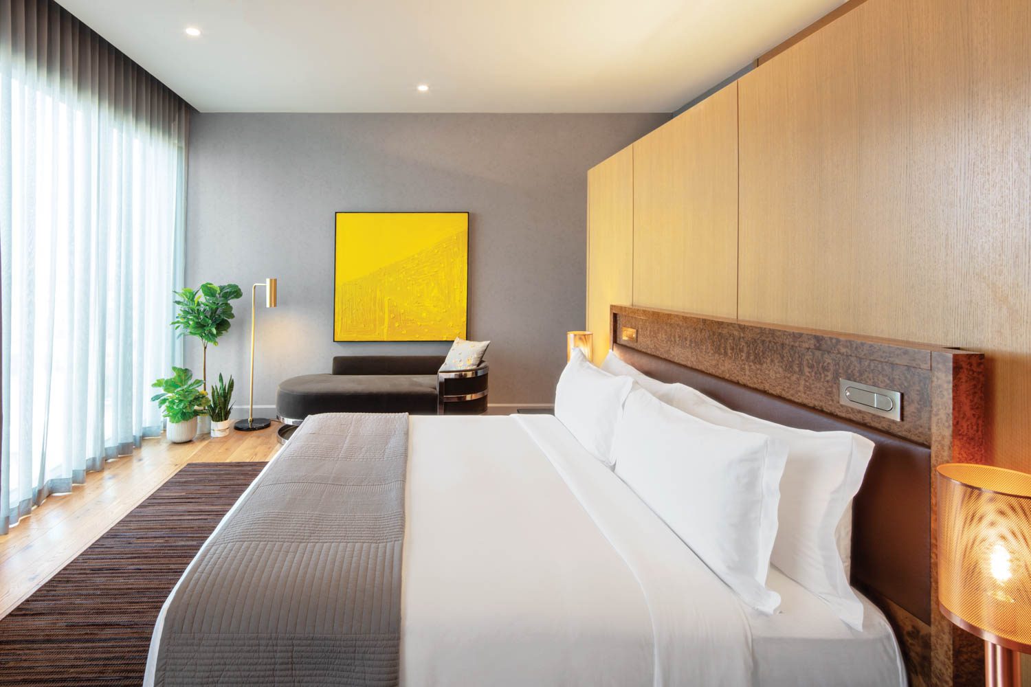 A partition of rift-sawn red oak separates the presidential suite bedroom from its bathroom. Photography by Eric Laignel.