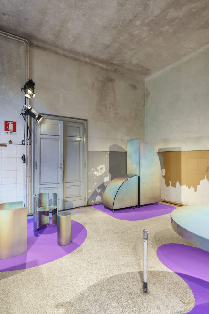 Curvy furnishings with a rainbow sheen