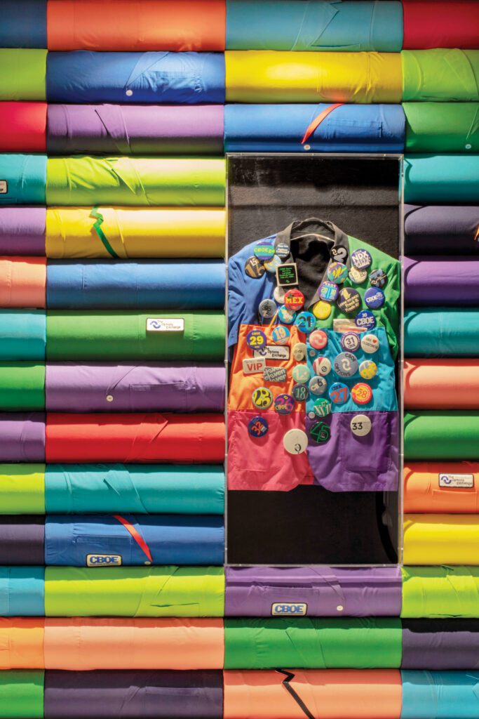 The colored jackets formerly worn by floor traders form a conference-room installation.