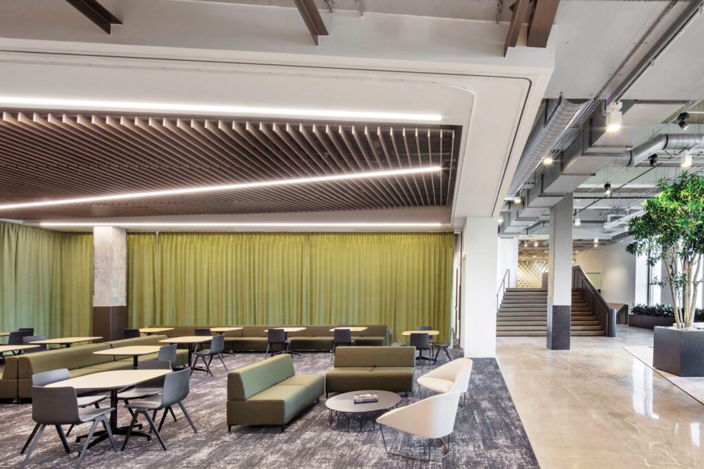 Operable partitions, sliding glass panels, and felt curtains allow the town hall lounge to be easily reconfigured.