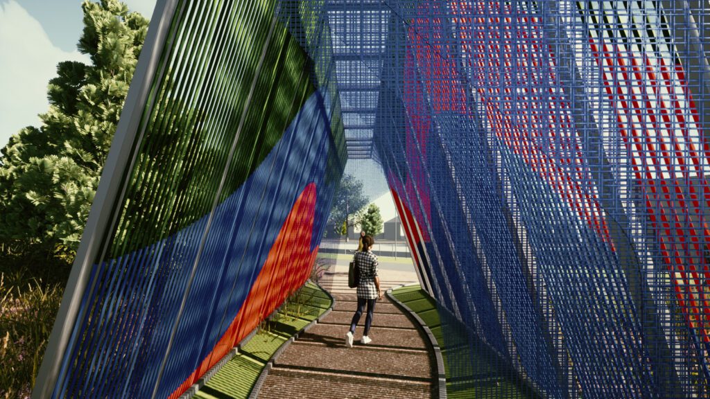 A woman stands beneath a blue and red woven tunnel that serves as a public art installation.