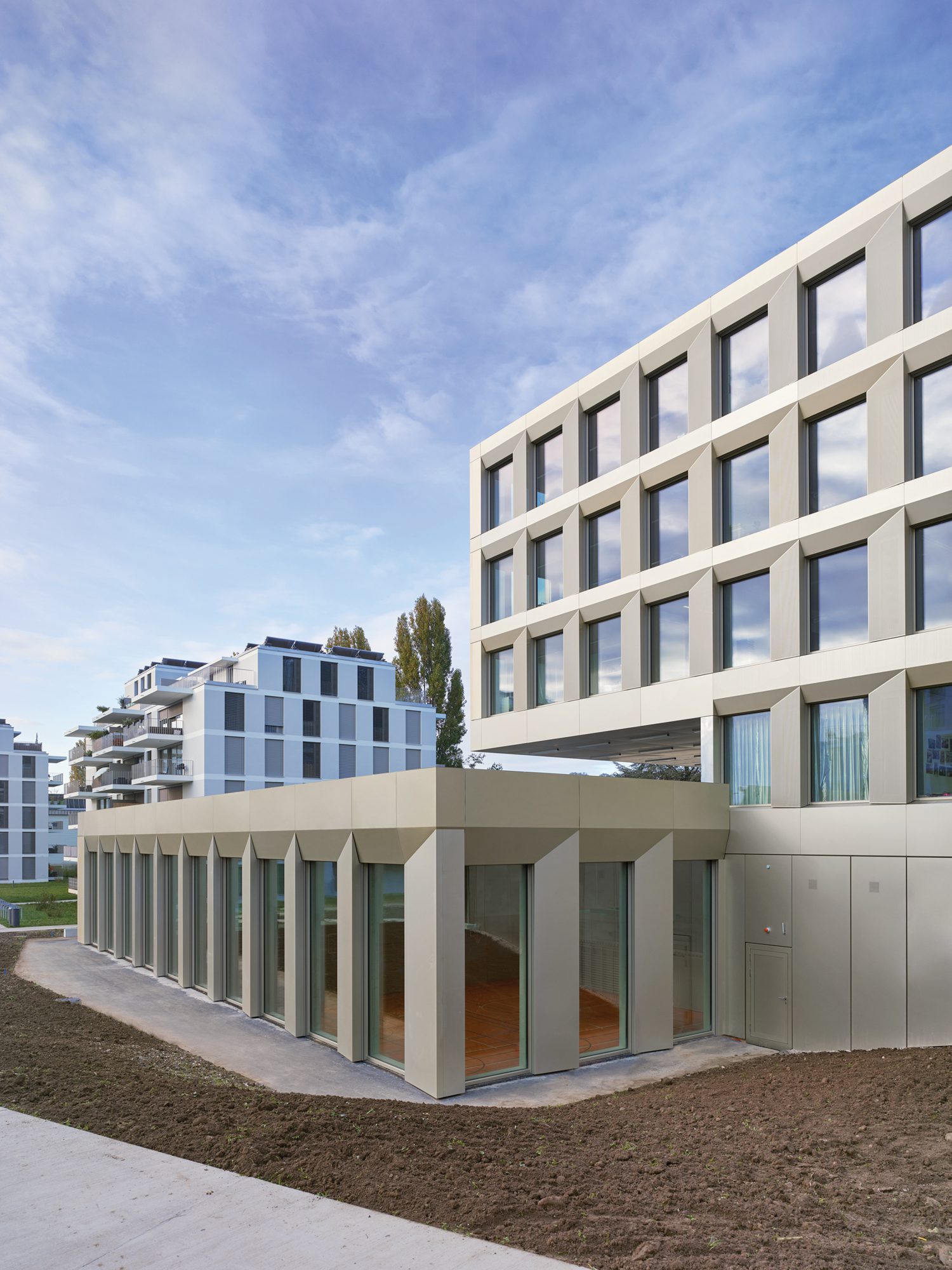 Exterior of building with a grid of windows.