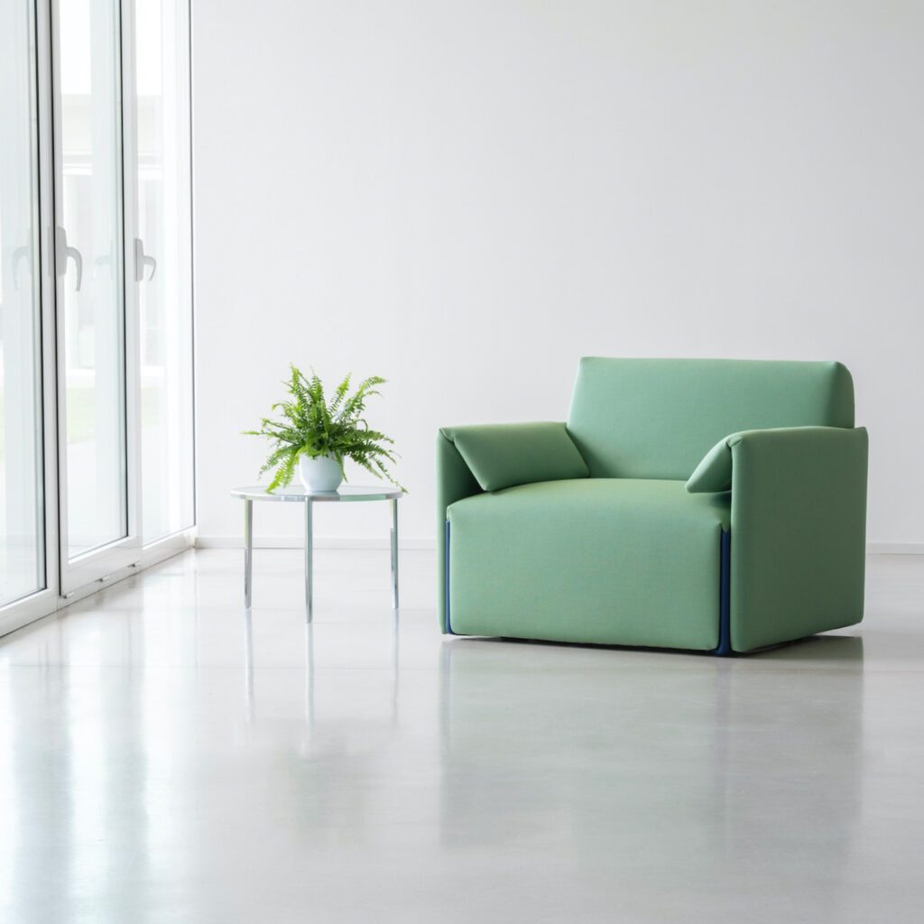 Armchair in a soft green hue.