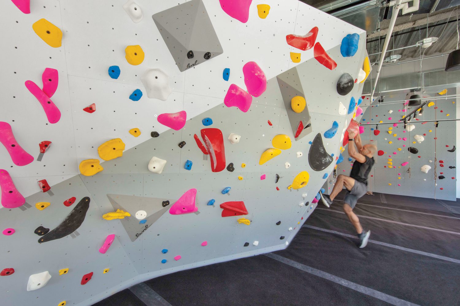 In the fitness center at the VF Corporation headquarters in Denver, Rapt Studio installed a 26-foot-tall climbing wall.