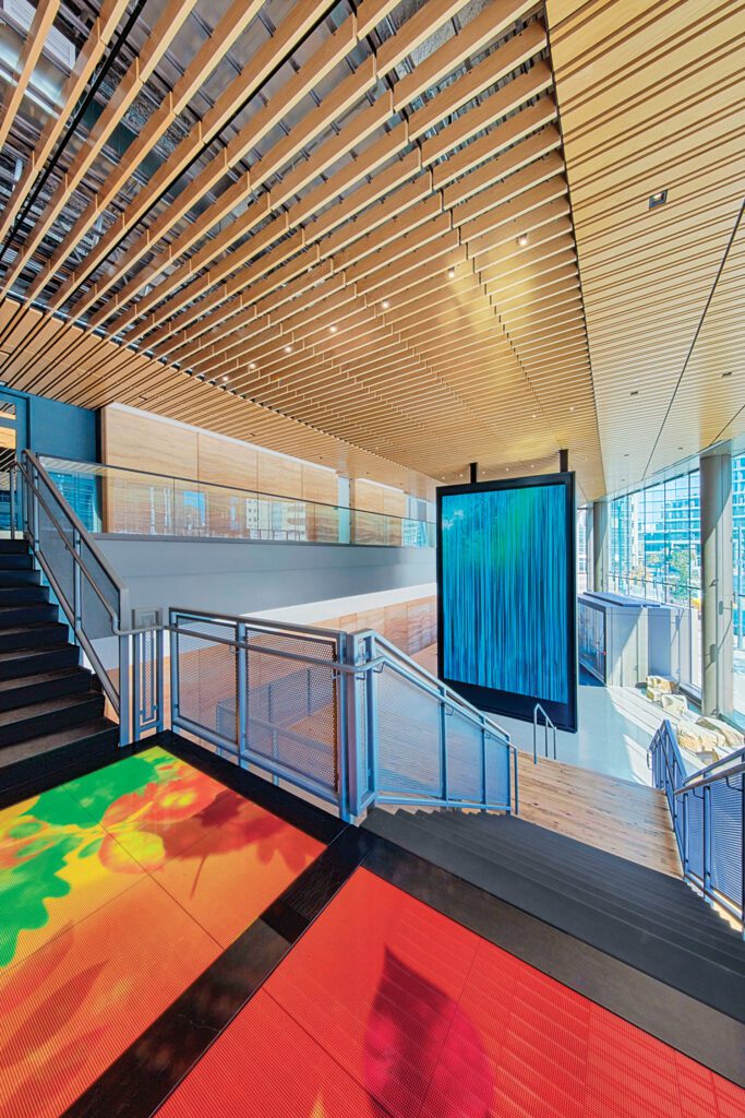 Interactive LED floor panels on the lobby stair landing.