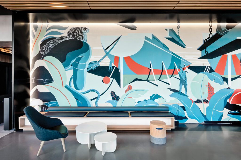 Bryce Wymer’s mural anchors another lobby vignette.