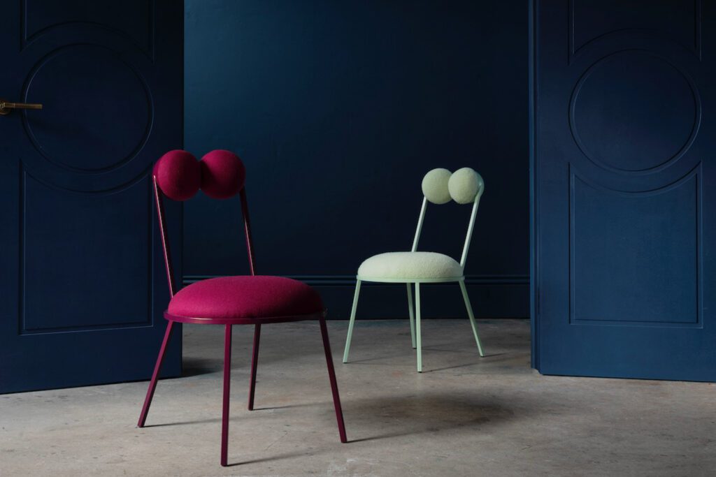 Described by the designer as “almost froglike,” the powder-coated steel Trevor dining chair has two round upholstered cushions – frog eye-like – forming its back. 