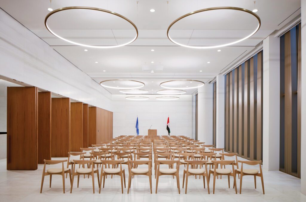 Beneath Rama Mendelsohn pendant fixtures, Hans Wegner’s Elbow chairs populate a multipurpose room.