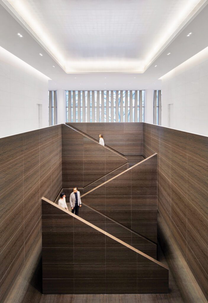 The stairs lead to a pre-function area that shares the entry hall’s hand-gilded metal-leafed plaster cove ceiling.