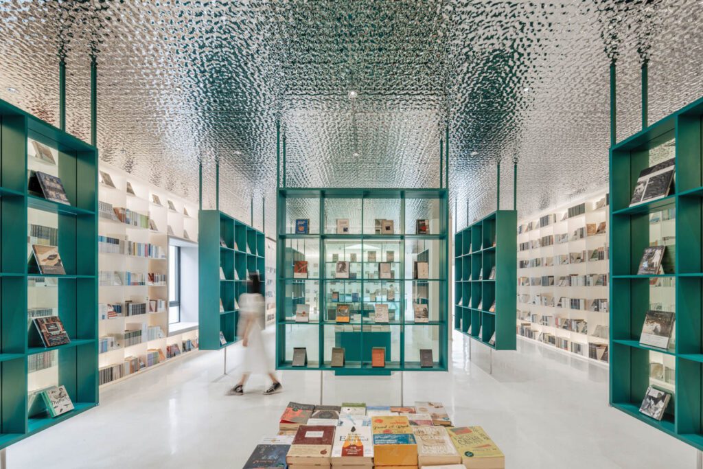 At Duoyun Bookstore in Taizhou, China, by Wutopia Lab, a ceiling of corrugated galvanized steel panels is meant to mimic the rippling water of the neighboring Yongning River.