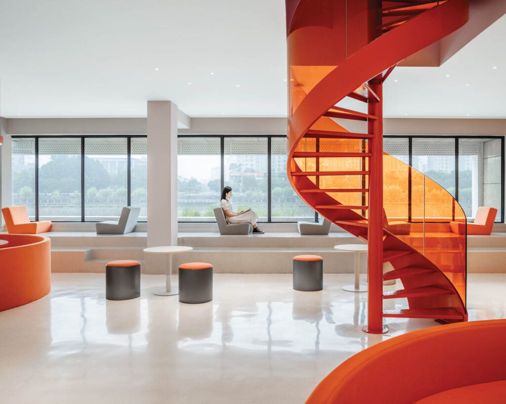 Acrylic forms the cafe stair's balustrade, and flooring throughout is terrazzo.