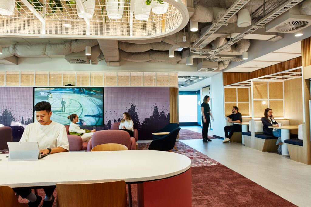 A lounge on the 28th floor features a computer ‘key’ wall with seating by Jardan upon Tappetti wool carpeting and Shaw Contract carpet tile; to the left, rattan screens divide booths upholstered by Willie Weston.