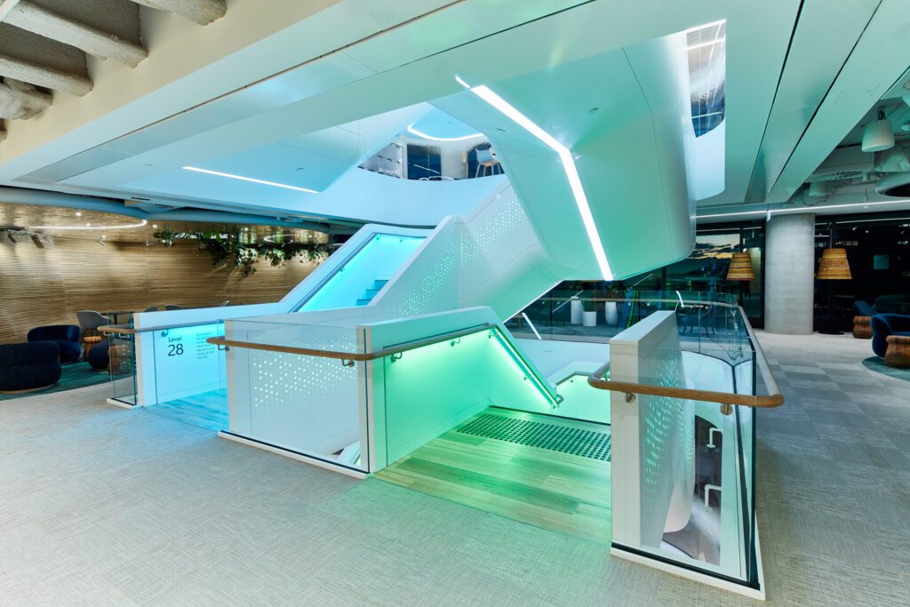 ICON designed the corian-clad staircase which interconnects all seven floors; on the 28th floor, the carpet tiles are by Shaw Contract.