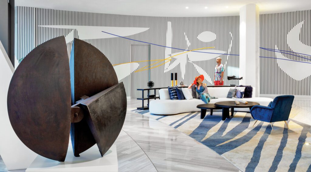 Art in the lobby at One Park Grove, a residential tower in Miami by OMA, with public spaces by Meyer Davis, includes a bronze by Argentine sculptor Alberto Bastón Diaz and a mural by Venezuelan painter Paul Amundarian.