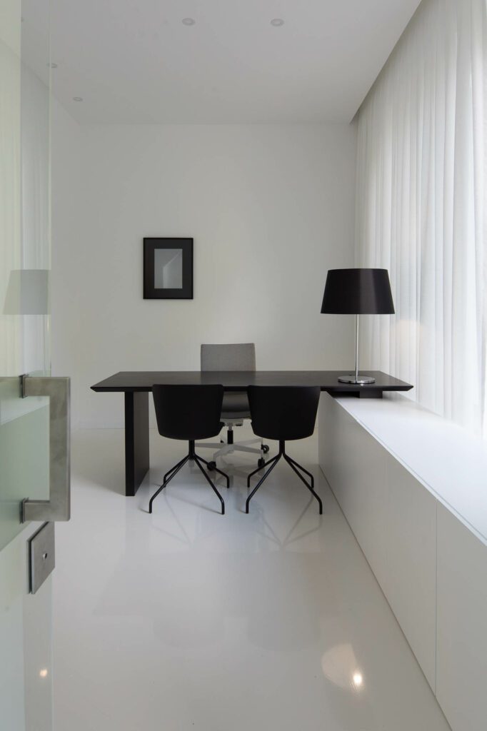 In the CEO’s office, a Paulo Coelho lamp sits on a custom desk.