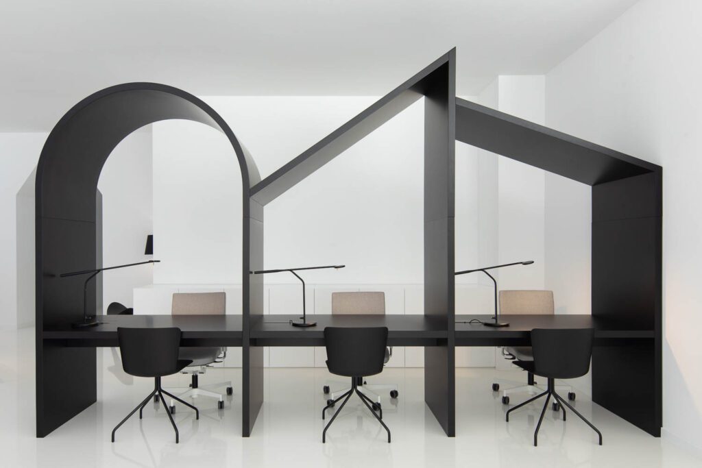 Workstations offer Levira task chairs, Midj seating, and tasklights by Normann Copenhagen.