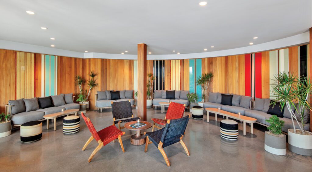 Paneling of surfboard-inspired fiberglass and sapele mahogany at the Alila Marea Beach Resort bar