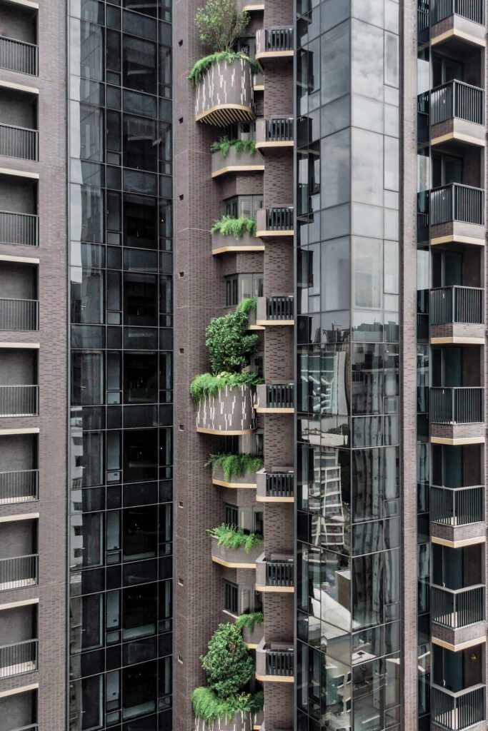 The 30-story tower, which features lushly planted apartment balconies, is by AGC Design.