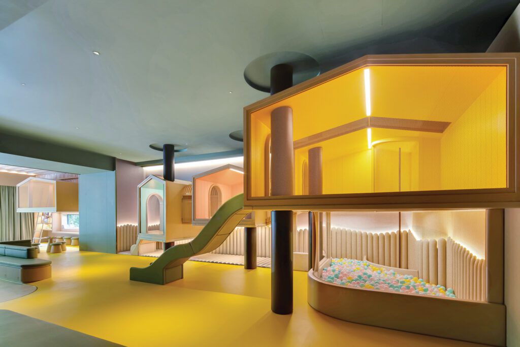 A network of floating cabins turns the children’s area into a miniature city.