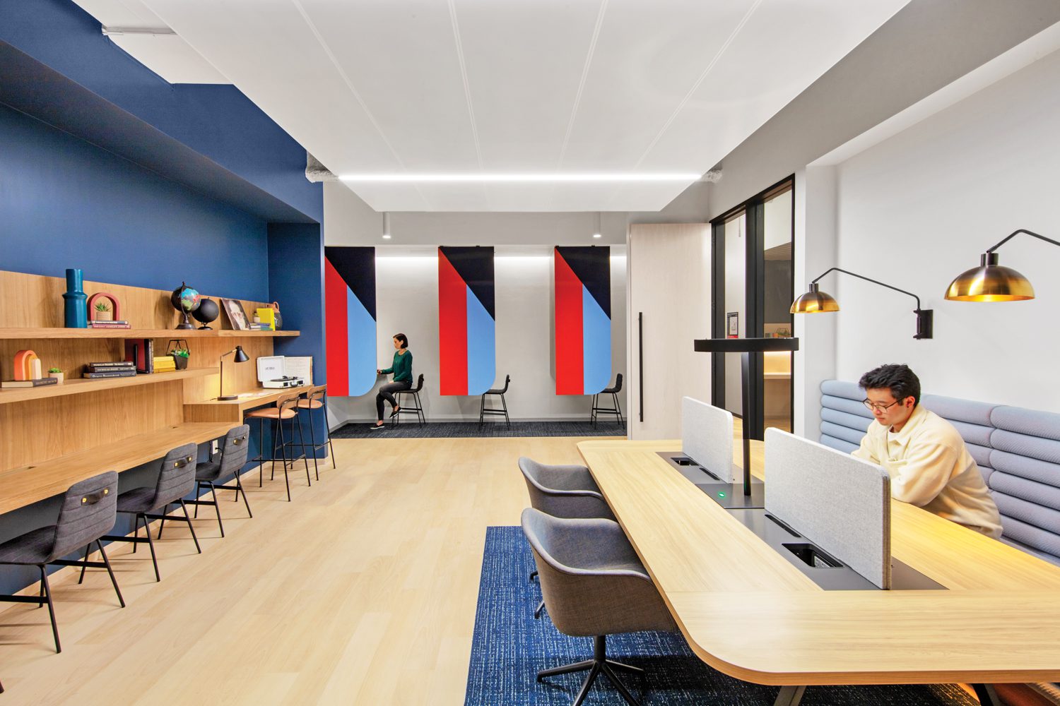 Also in building two, by SHoP and RMW, custom shelving in planked walnut veneer nods to old-school carrels in the library, for heads-down work.