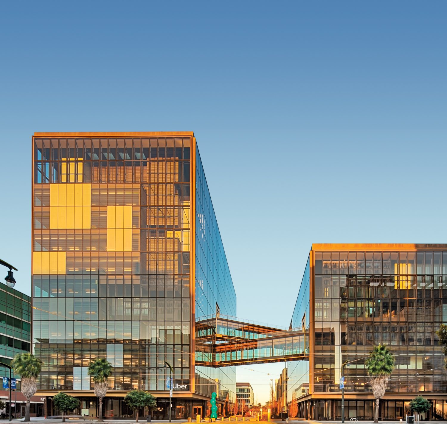 For buildings one and two, with architecture by SHoP, the smaller of the two double-story lobbies is a cube surrounded by dichroic glass tubes.