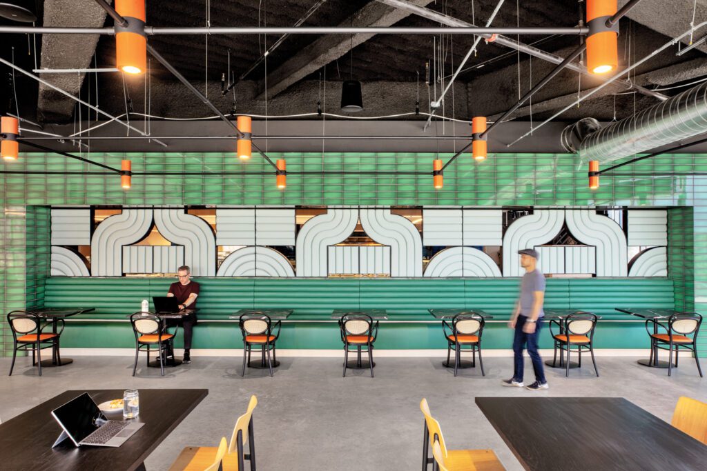 Huntsman combined two local ceramic tiles with stitched fabric for the dividing wall between food service and seating in building three and four’s shared cafeteria.