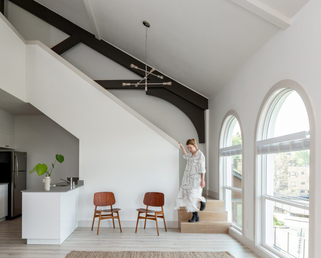 Arched windows flood the units with natural light.