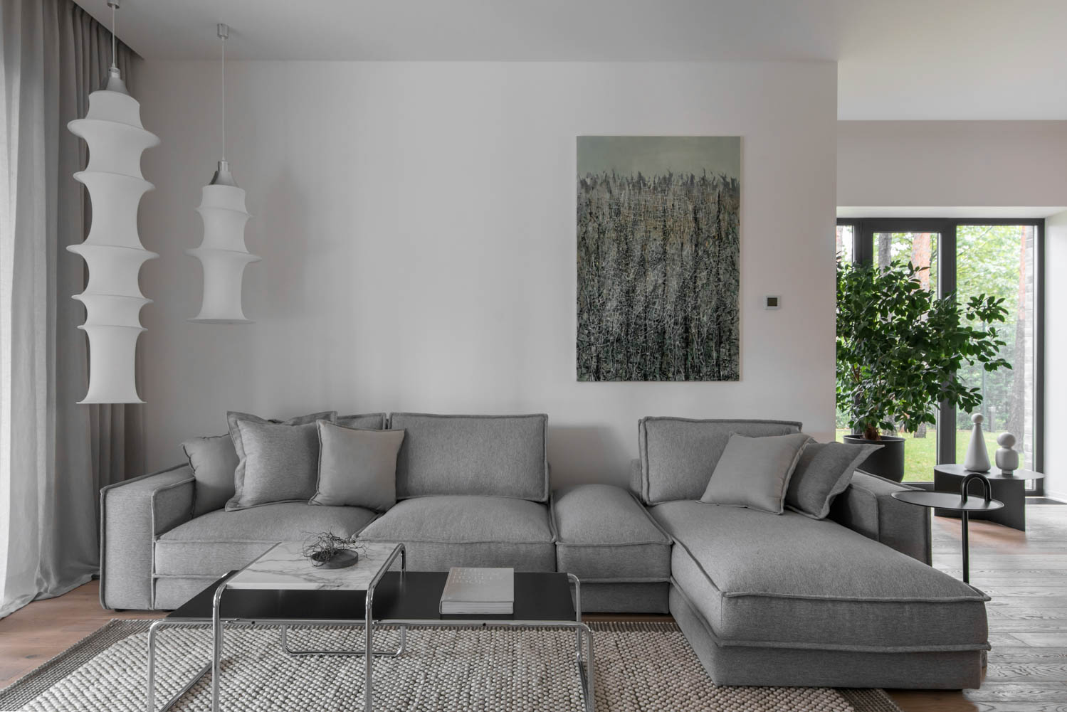 In the living area, the coffee table is by Marcel Breuer and pendants are by Bruno Munari.