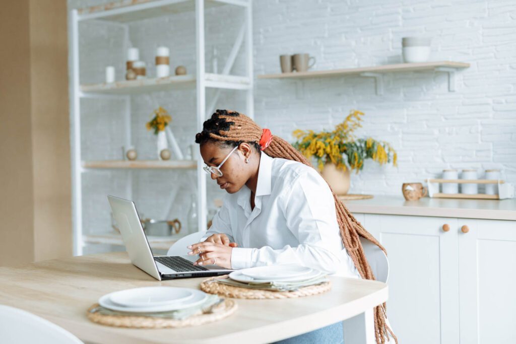 Woman working from home, photo by Thirdman from Pexels