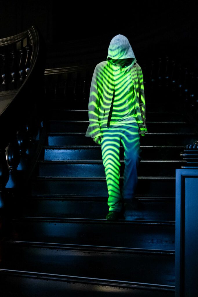 The exhibit was designed by ESI Design, NBBJ's experience design studio, and projected patterns from garments onto visitors as they walked the staircase.