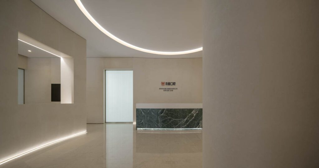 A green marble desk defines the airy reception area.