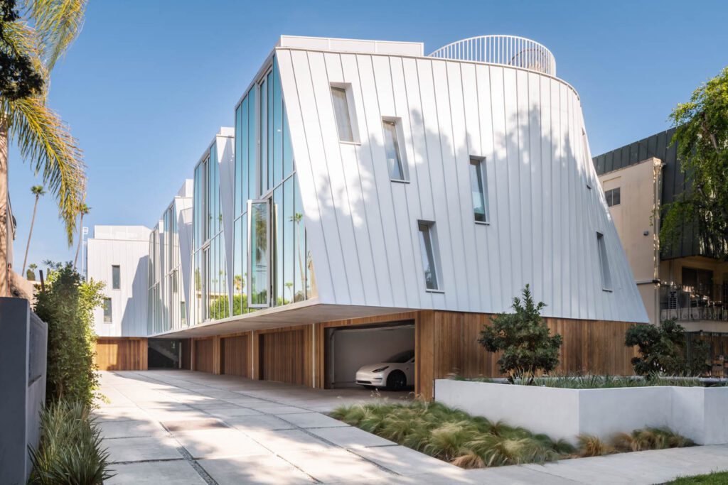 All five homes have double-height front glazing and side windows for daylight.