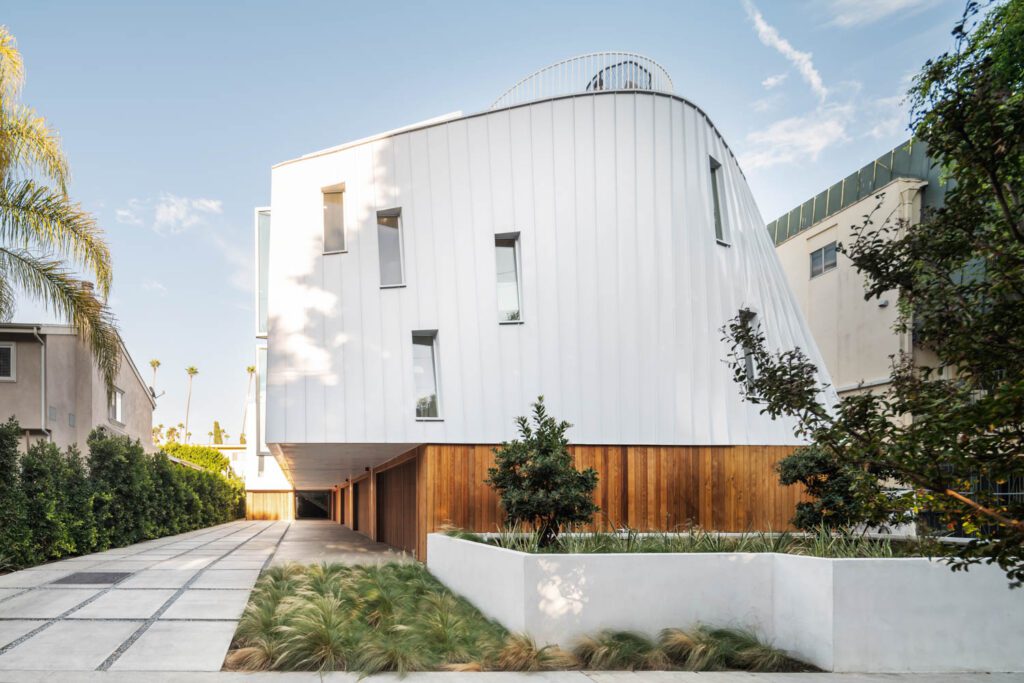 Houses occupy an infill lot bringing density while respecting the neighborhood’s residential scale.