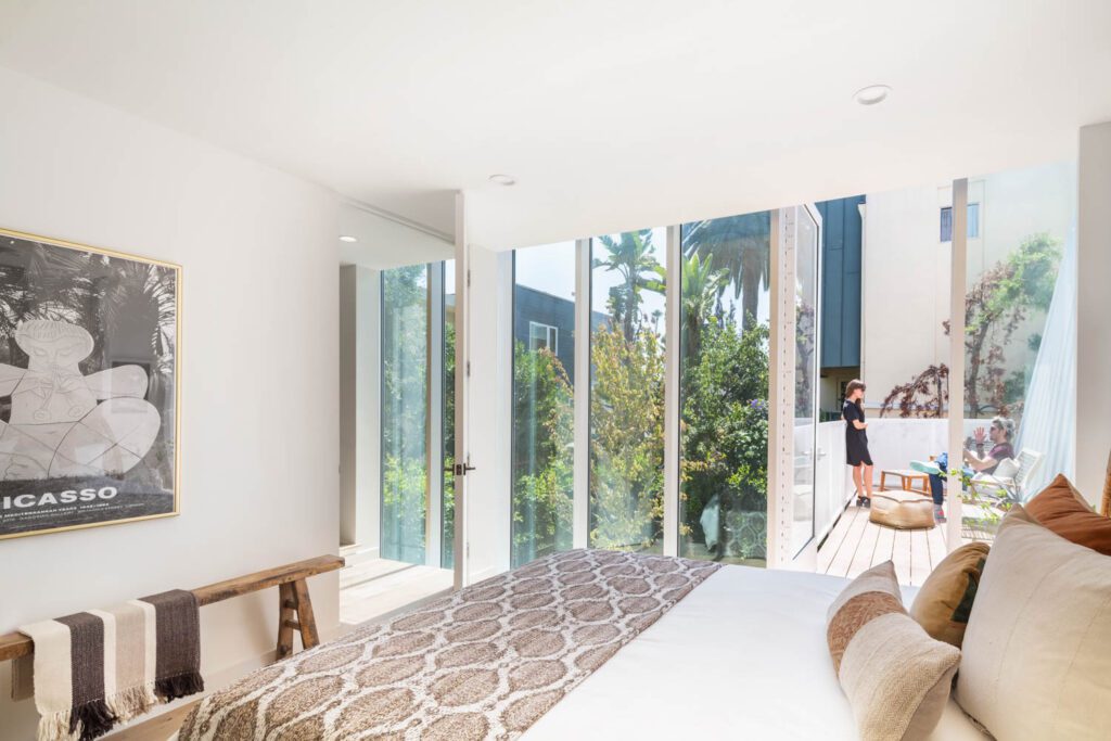 French doors open to a terrace off the main bedroom.