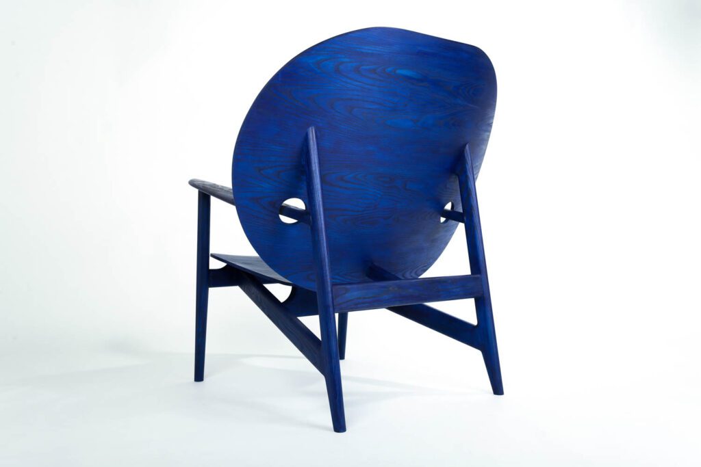 Mac Collins designed his first Iklwa chair as his graduation project in the summer of 2018. Its oversized back and headrest and throne-like appearance are supposed to protect and elevate the sitter. Photography courtesy of Mac Collins.