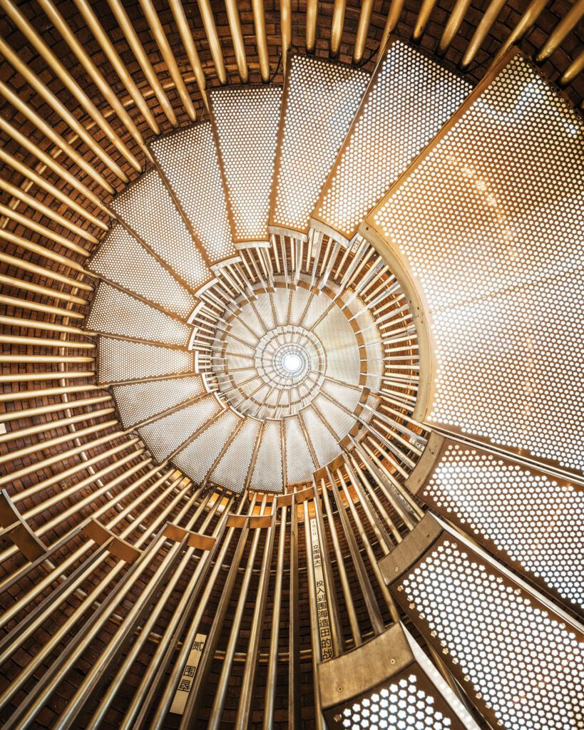 A new custom staircase is gold-finished stainless steel. The stair’s rods are electroplated steel. Photography courtesy of CreatAR Images.