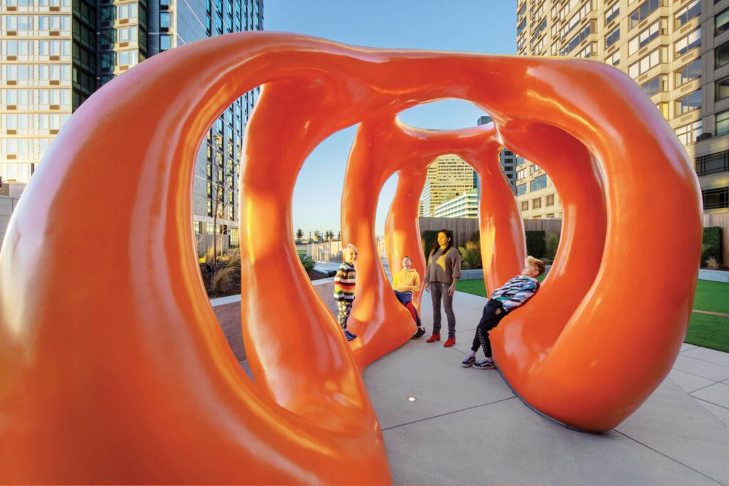 MAXIMILIAN PELZMANN: Pavilion, an 11-foot-tall sculpture in mixed materials, stands on the concrete-paved amenity deck at VYV, a two-tower residential complex in Jersey City, New Jersey, by Arrowstreet, Perkins Eastman, and Studios Architecture. Photography: Eric Laignel.