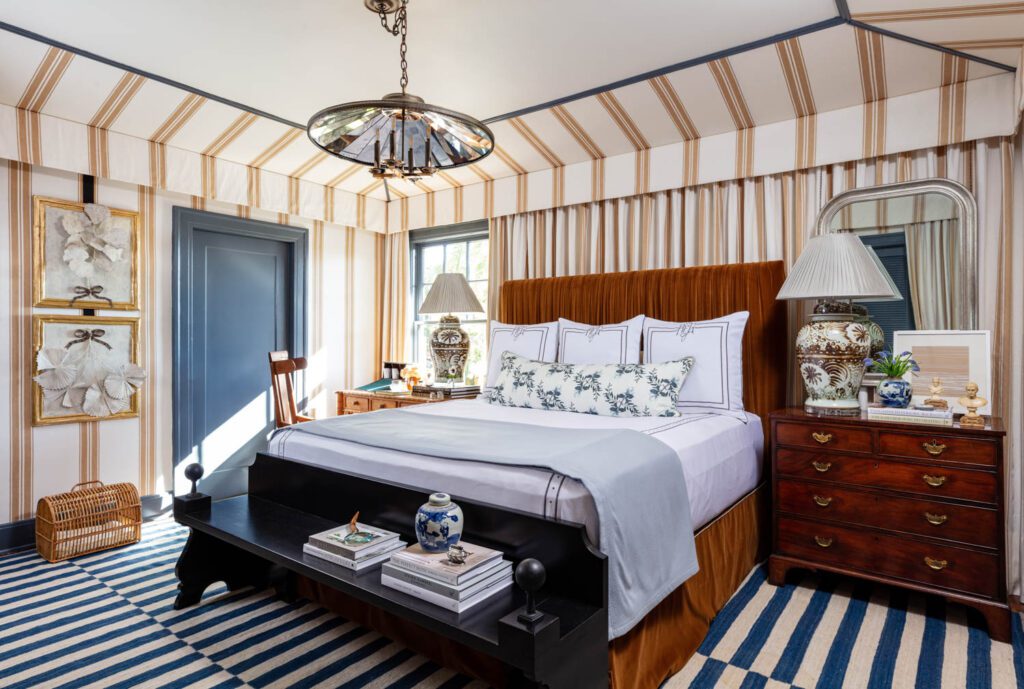 A master bedroom with striped walls and floors 