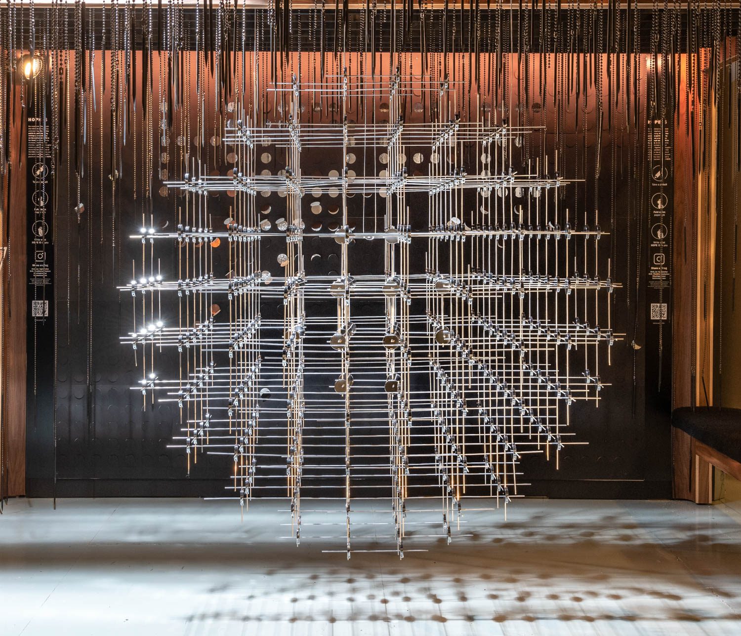 An installation of Hope with pens hanging from the ceiling.