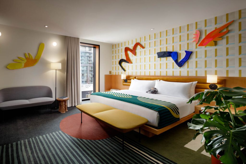 wall sculptures are above the main bedroom's bed