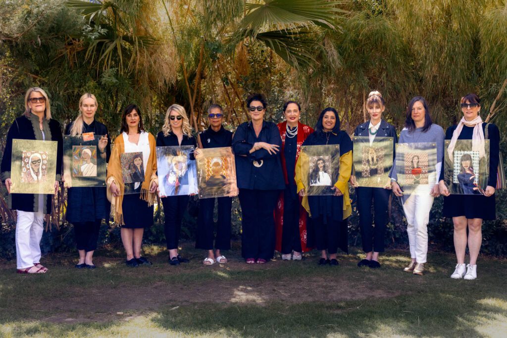 Cindy Allen and Rebecca Moses surrounded by the women in design Moses sketched at a dinner Sunday evening. 