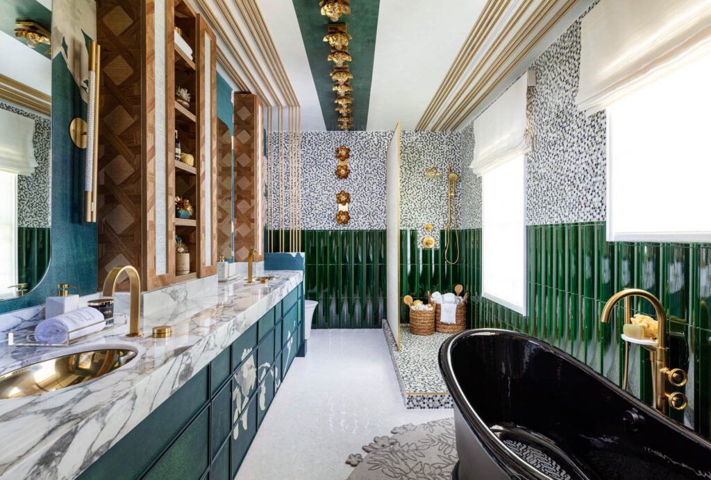 A luxurious bathroom with floral wallpaper and green accents