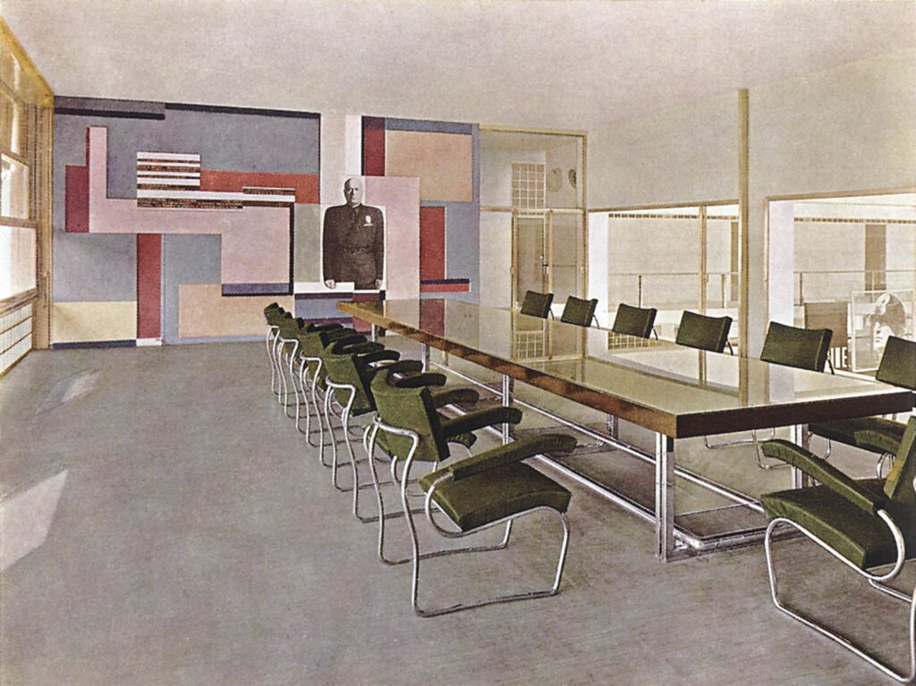 A vintage office room with green chairs