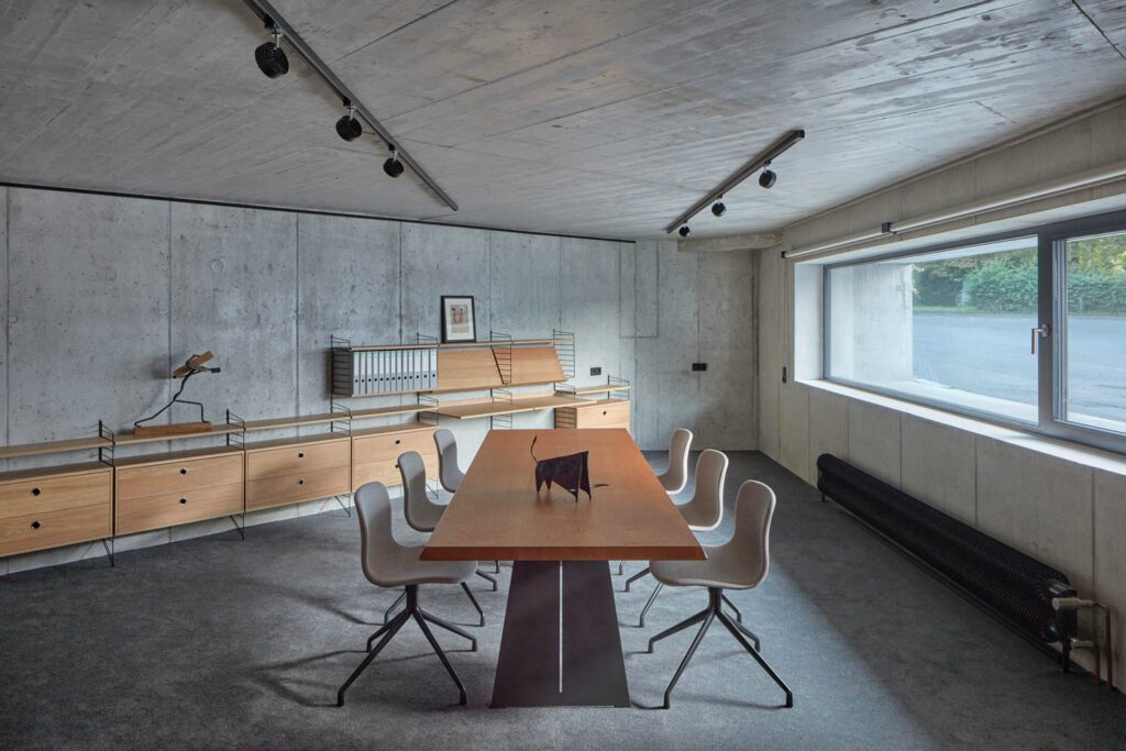 a dining room lit up by a large horizontal window