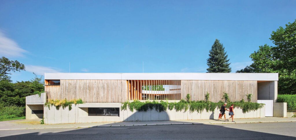 the exterior of the house accented by greenery