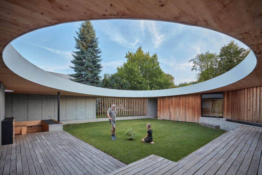 a tree is planted in the center of the circular skylight